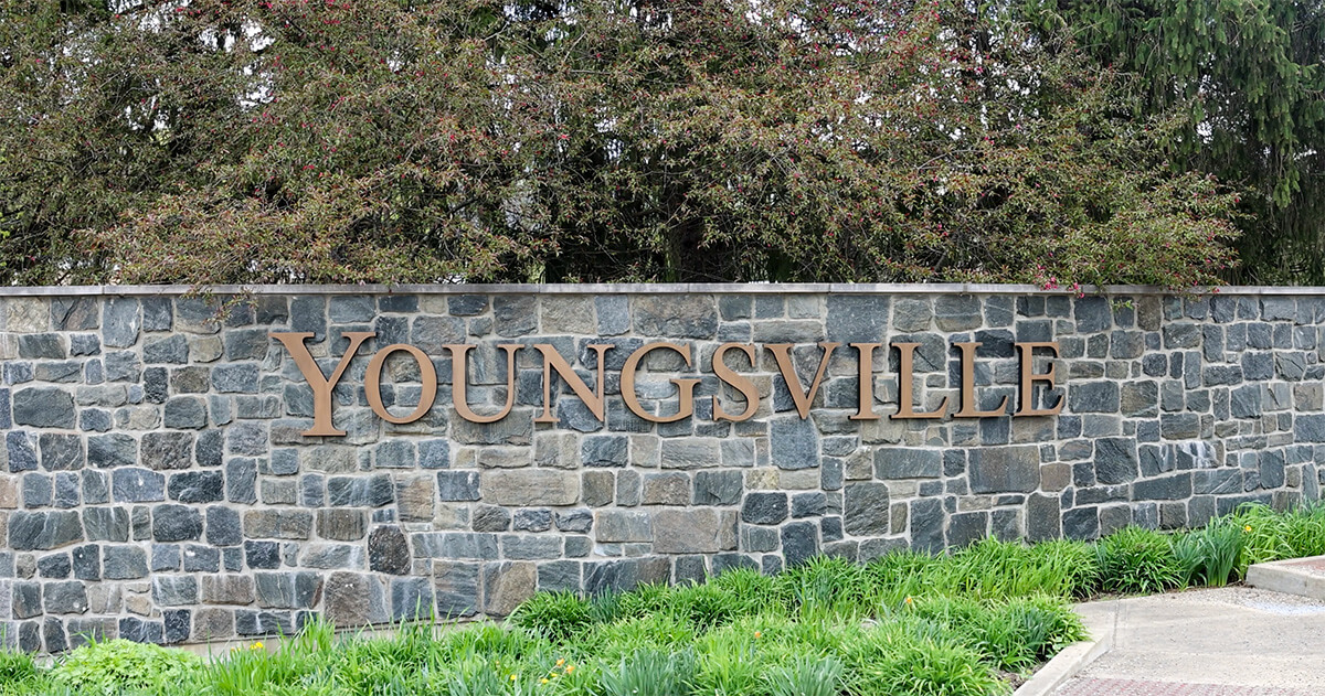 Youngsville PA stone welcome sign in Warren County, featuring the community momentum of Troy Clawson's Citizen Spotlight.